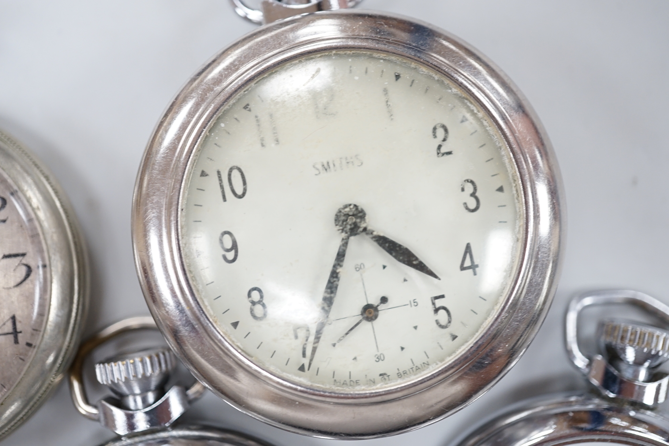 Ten assorted base metal pocket watches including Ingersoll football related, Smiths and Smiths Empire etc.